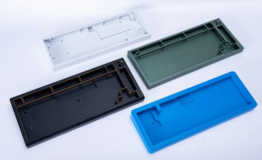 Four keyboard housings with machined pockets and mounting features