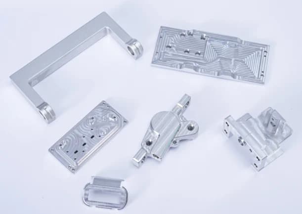 Machined plates, brackets and a frame with pockets and mounting features